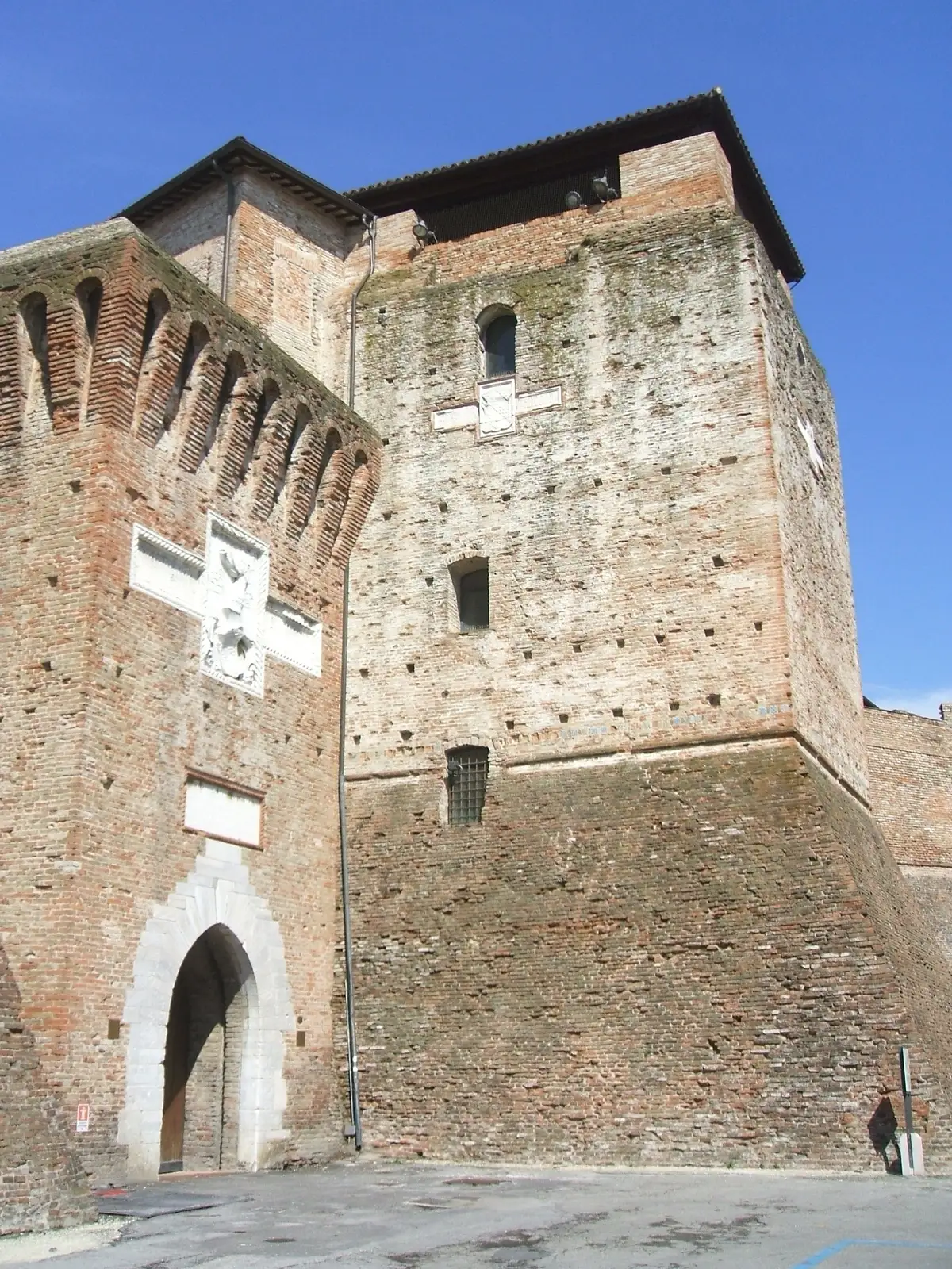 The crenellated walls and corner tower of Castel Sismondo in Rimini