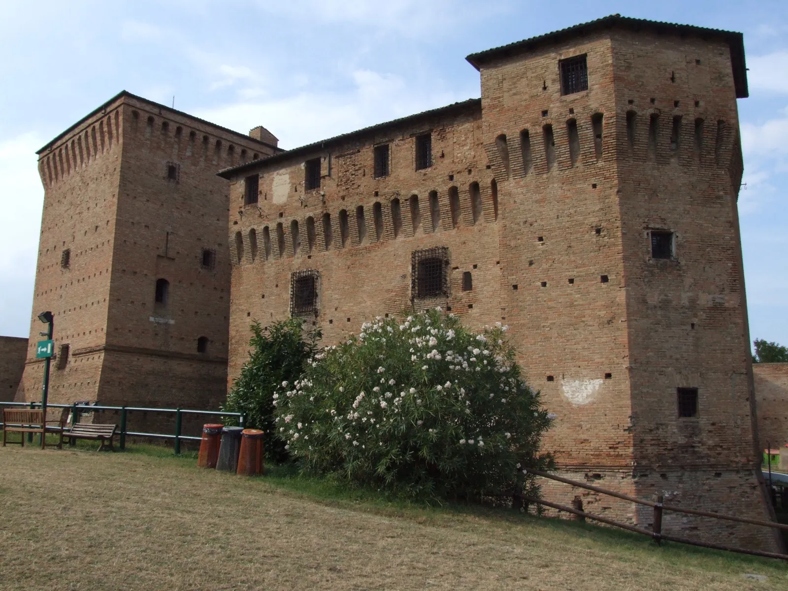 The brick facade of the Rocca Malatestiana of Cesena, seen from below